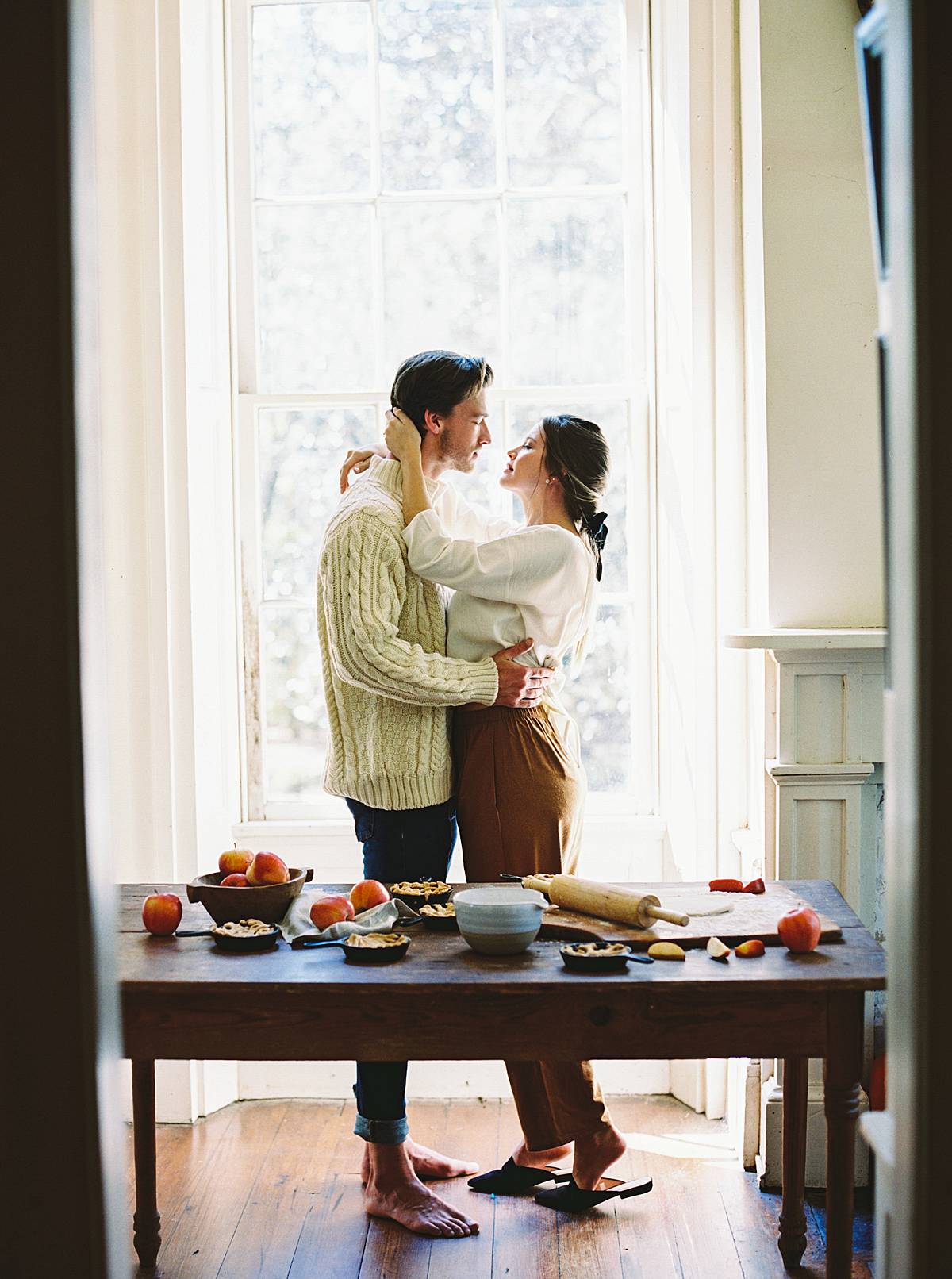 charleston elopement photography adventure on film with bride and groom in kitchen making pies
