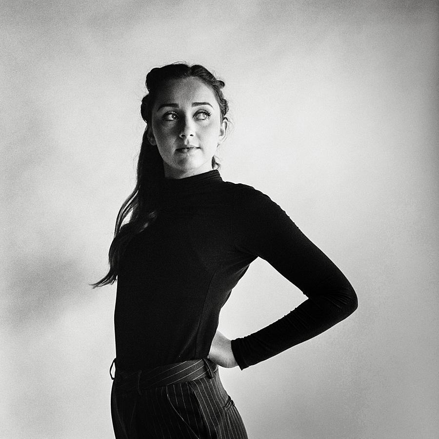 black and white film studio portrait of girl in black turtleneck at studio sixty reid with kodak tri-x pushed film
