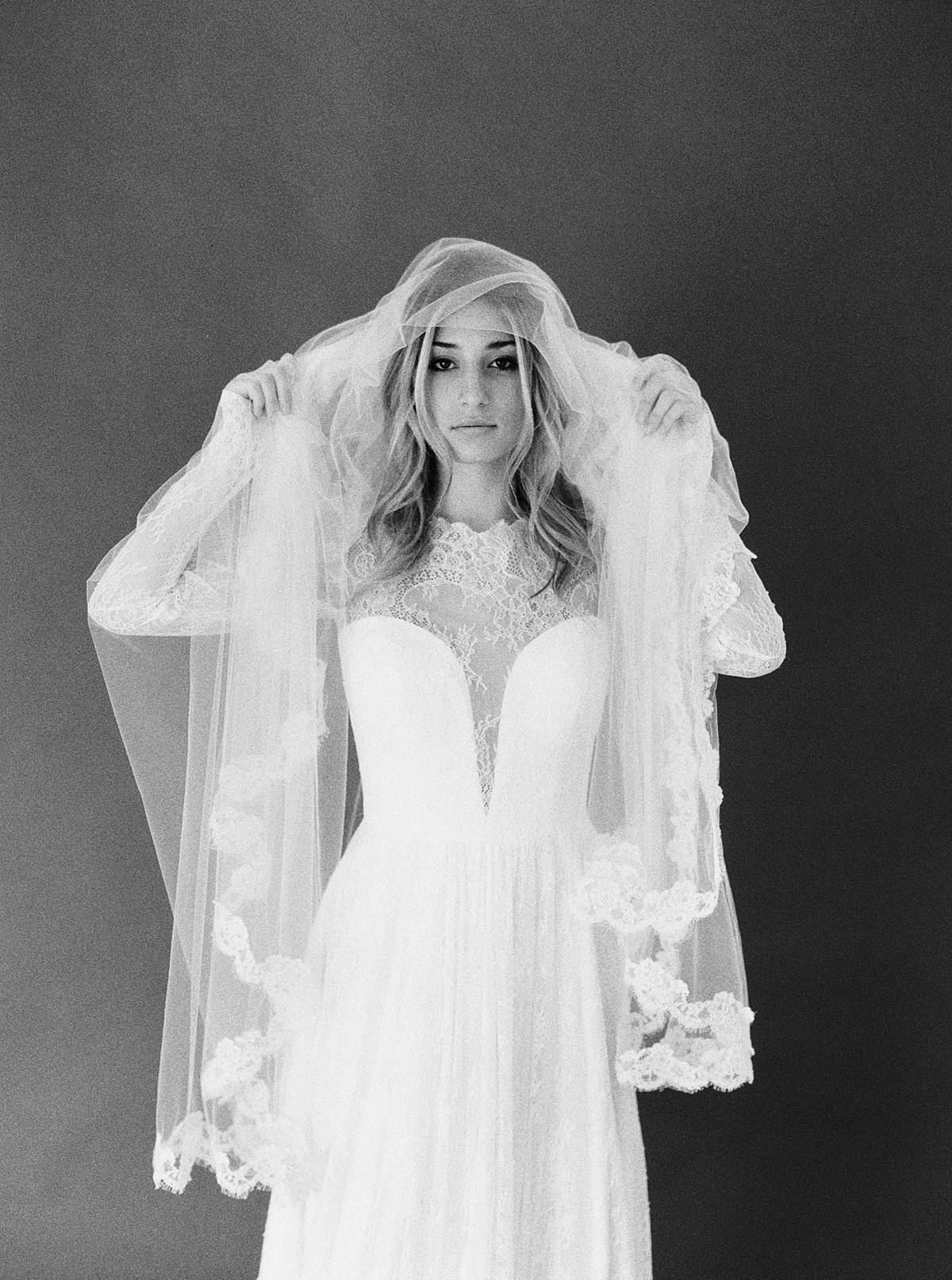 studio bridal portrait in charleston sc by brian d smith photography on ilford delta 3200 medium format film with lace veil overhead