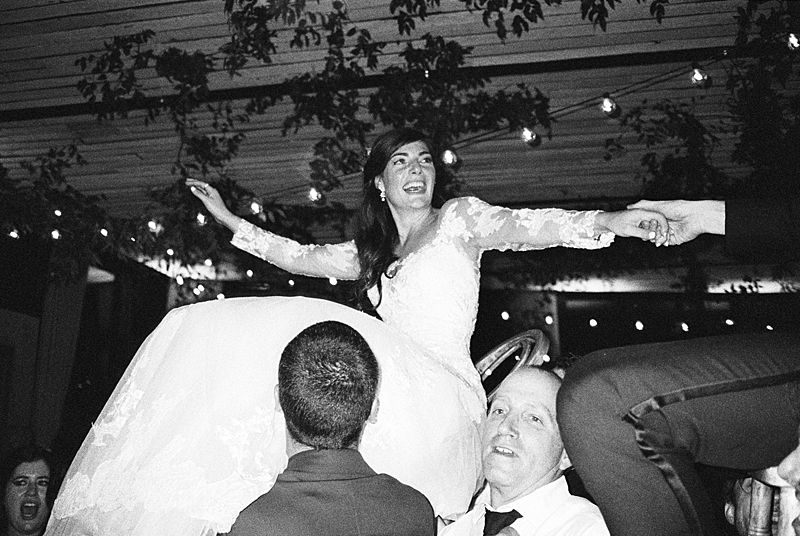 bride and groom dancing the horah at middleton place on kodak p3200 35mm film