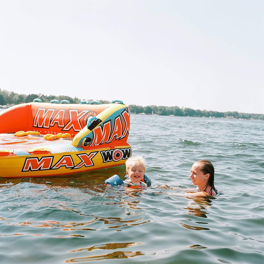 documentary family photograph on a lake in michigan on kodak portra 800 film with hasselblad 202fa
